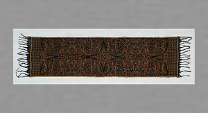 影絵人形文経緯絣肩掛（グリンシン）